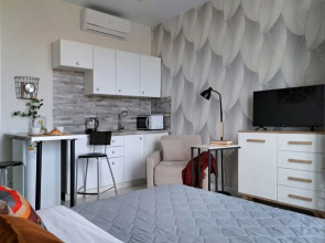 Апартаменты Wing Tower - высотная студия в центре