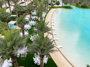 Апартаменты Сozy 1BR at Vida Residences Creek Beach