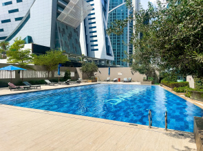 Апартаменты Stylish 1BR at Damac Merano Tower with Great View