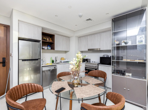 Апартаменты Сozy 1BR at Vida Residences Creek Beach