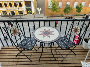 Квартира Уютный Лофт с балконом на главной улице Столицы Закатов