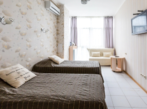 Апартаменты Светлана-Центр у моря с видом на сад магнолий