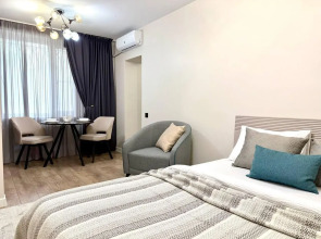 Современная студия в центре Апартаменты