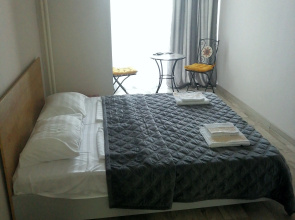 V Tsentre Goroda Apartments