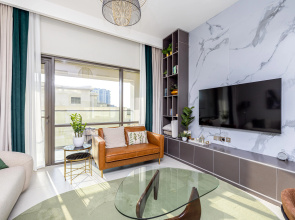 Апартаменты Сozy 1BR at Vida Residences Creek Beach