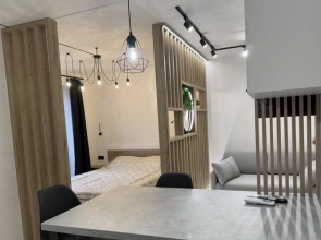 V Tsentre Goroda Apartments