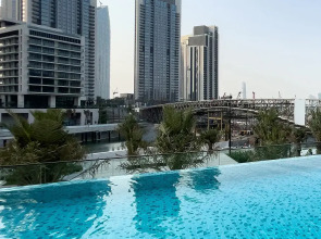 Апартаменты Сozy 1BR at Vida Residences Creek Beach