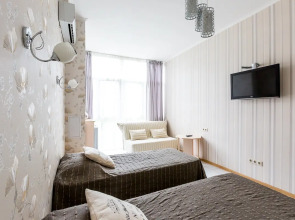 Апартаменты Светлана-Центр у моря с видом на сад магнолий