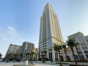 Апартаменты Сozy 1BR at Vida Residences Creek Beach