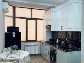 V Tsentre Goroda Apartments