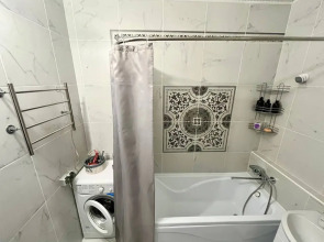 Квартира Уютная студия в 5 минутах от ТРЦ Планета