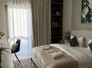 Апартаменты Сozy 1BR at Vida Residences Creek Beach