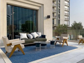 Апартаменты Сozy 1BR at Vida Residences Creek Beach