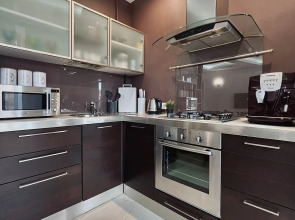 Апартаменты Уютная двухкомнатная квартира рядом с ЦУМом