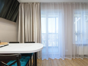 Квартира Новая студия в 5 минутах от ТРЦ Аура