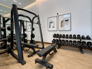 Апартаменты Сozy 1BR at Vida Residences Creek Beach