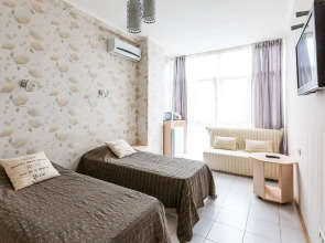 Апартаменты Светлана-Центр у моря с видом на сад магнолий