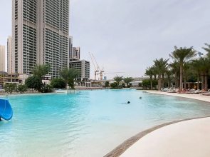 Апартаменты Сozy 1BR at Vida Residences Creek Beach