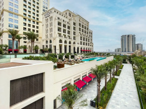 Апартаменты Сozy 1BR at Vida Residences Creek Beach