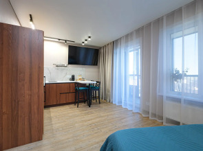 Квартира Новая студия в 5 минутах от ТРЦ Аура