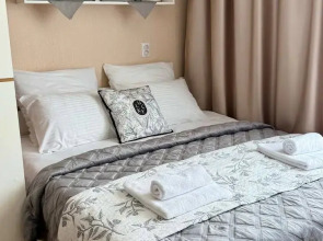 Квартира Уютная студия в 5 минутах от ТРЦ Планета