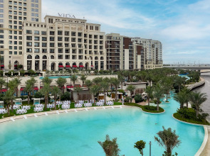 Апартаменты Сozy 1BR at Vida Residences Creek Beach