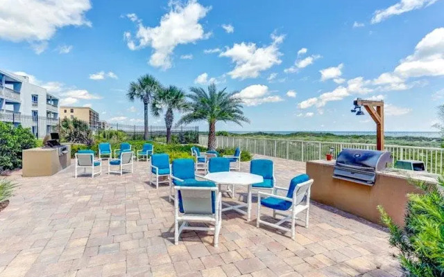 Upper unit Overlooking the Beautiful Outdoor Space and Pier by RedAwning