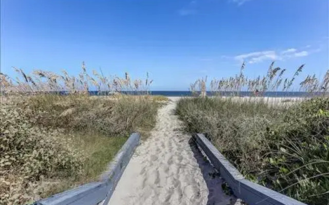 Seashore Condo with Balcony Overlooking the beach and the Atlantic by RedAwning