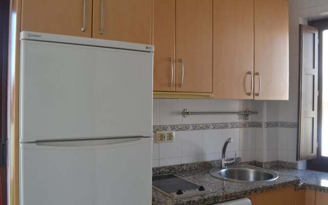 Reservaloen Puerta del Arenal / Topibe SL