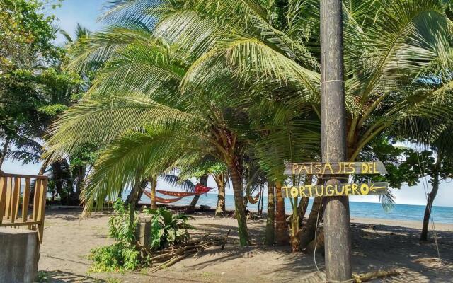 Paisajes del Tortuguero (On The Beach and Town Center)