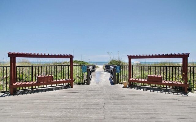 Coast View Condo Featuring Large Windows Overlooking the Beach by RedAwning