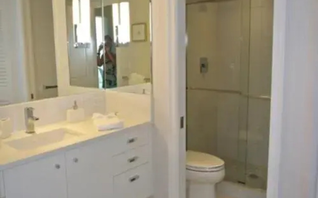 Deluxe Beachfront Condo Located in Prestigious Resort with Pool and Hot Tub by RedAwning