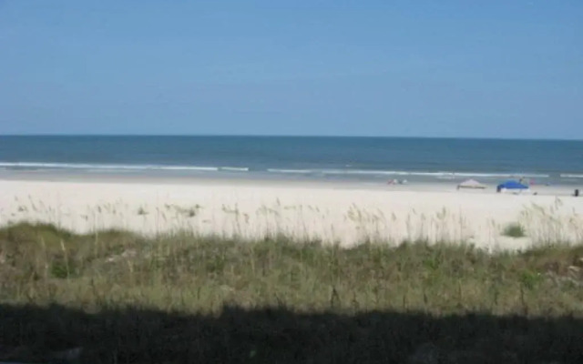 Coastline Condo with private Balcony to Enjoy Views of the Atlantic Ocean by RedAwning