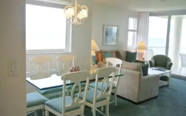 Deluxe Beachfront Condo Located in Prestigious Resort with Pool and Hot Tub by RedAwning