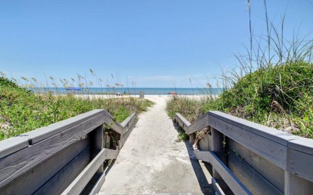 Coast View Condo Featuring Large Windows Overlooking the Beach by RedAwning