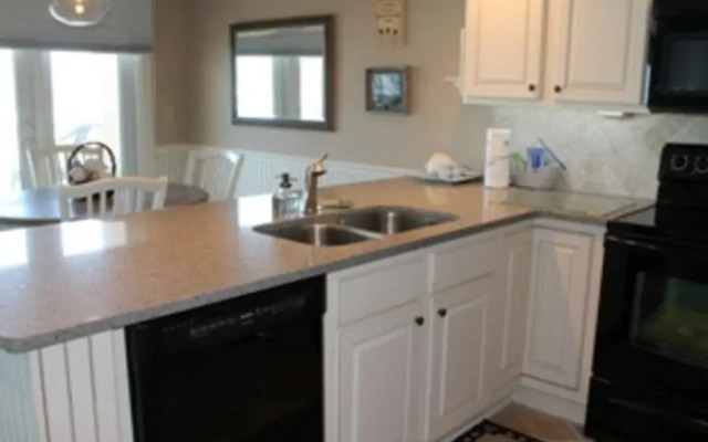 Coastline Condo with private Balcony to Enjoy Views of the Atlantic Ocean by RedAwning