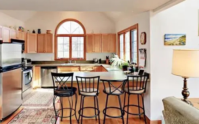 Woodsy Cape Cod Home by RedAwning