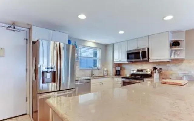North End Corner Unit with View of the Ocean and Miles of Sandy Beach by RedAwning