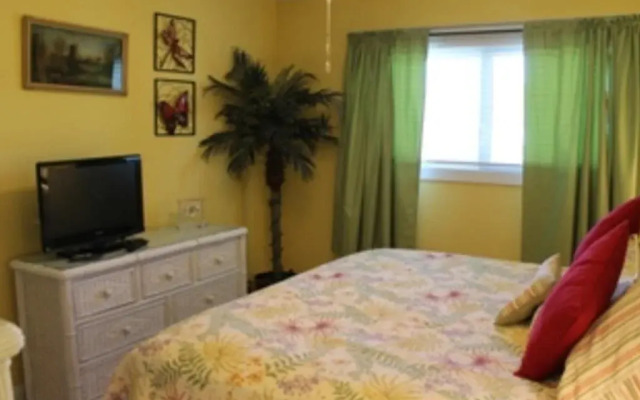 Coastline Condo with private Balcony to Enjoy Views of the Atlantic Ocean by RedAwning