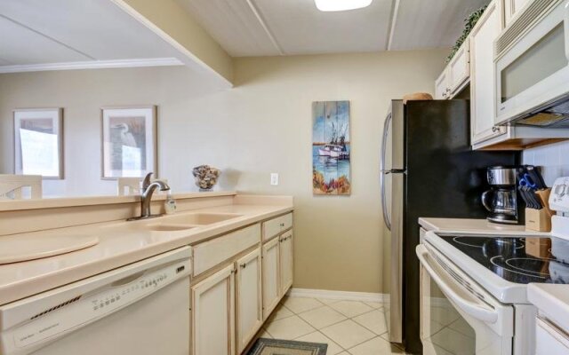 Coast View Condo Featuring Large Windows Overlooking the Beach by RedAwning