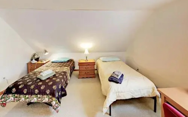 Woodsy Cape Cod Home by RedAwning