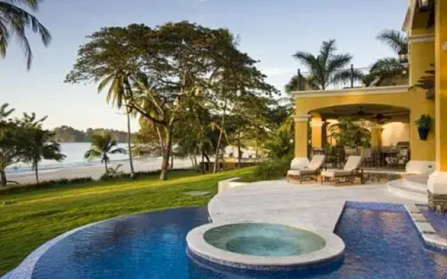 Mediterranean-style Flamingo Mansion Offers the Ultimate in Beachfront Luxury