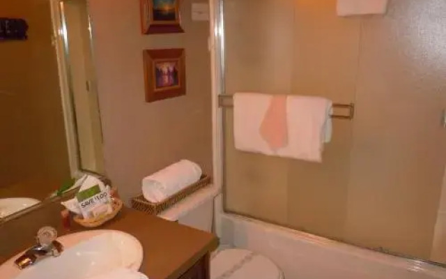 Two-Bedroom plus Den Deluxe Unit #124 by Escape For All Seasons