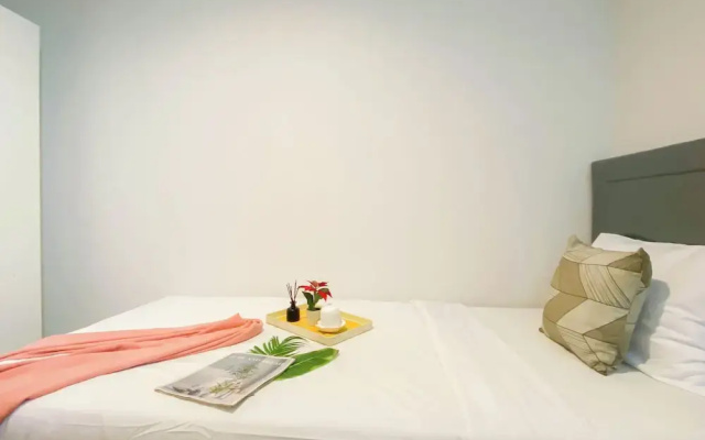 Simple 2Br At Azalea Suites Apartment