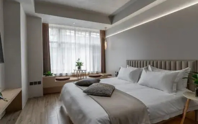 Yubwiku Tang Business Hotel (Tangshan Wuyue Plaza)