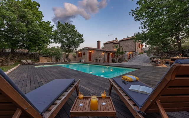 Stone house M&A with pool