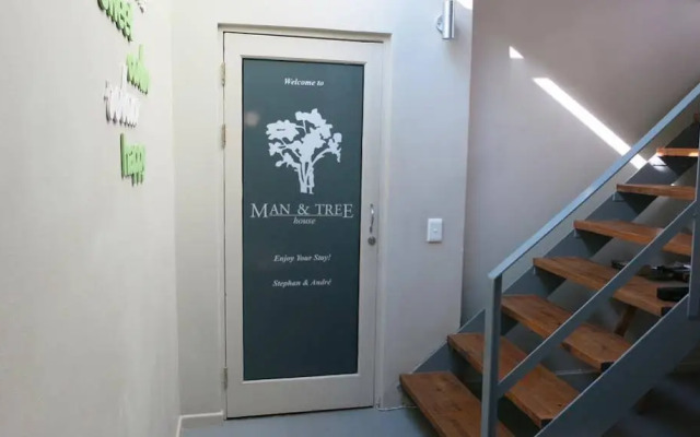 Man And Tree House