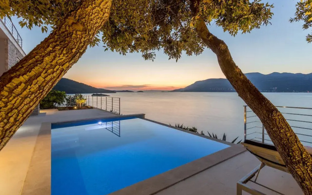 Beachfront Villa Poseidon with Heated Pool
