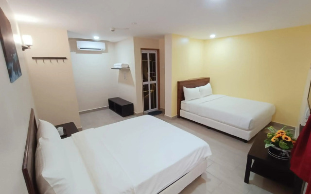 Capital O 90897 Island City Hotel