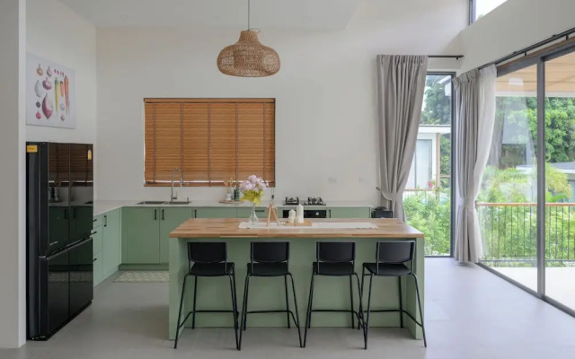 Tropical Poolside Retreat by Sea N' Rent